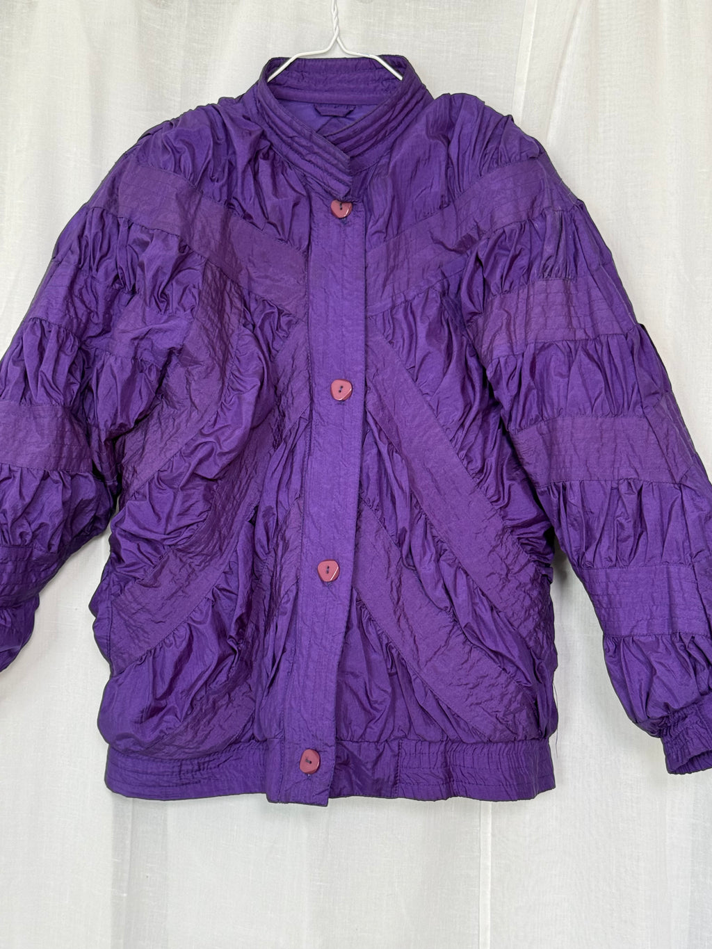 purple quilted nylon jacket