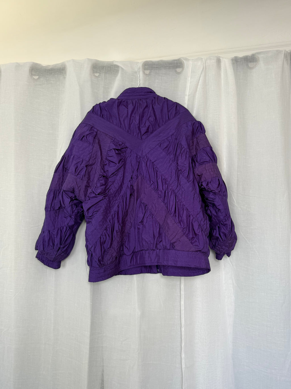 purple quilted nylon jacket