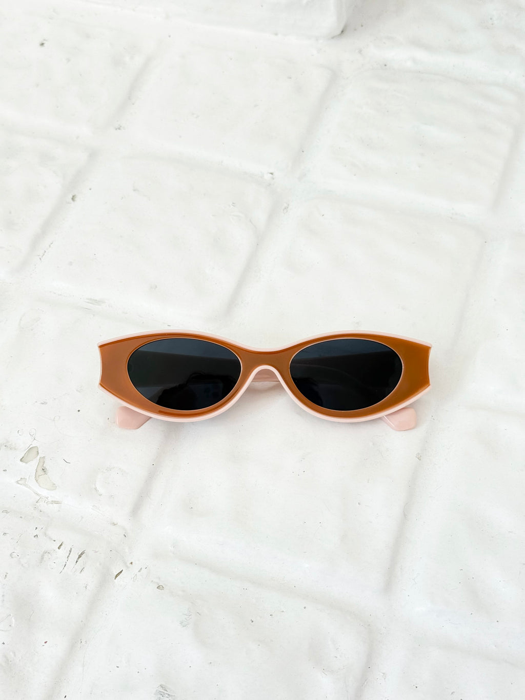 brown and pink oval slim sunglasses