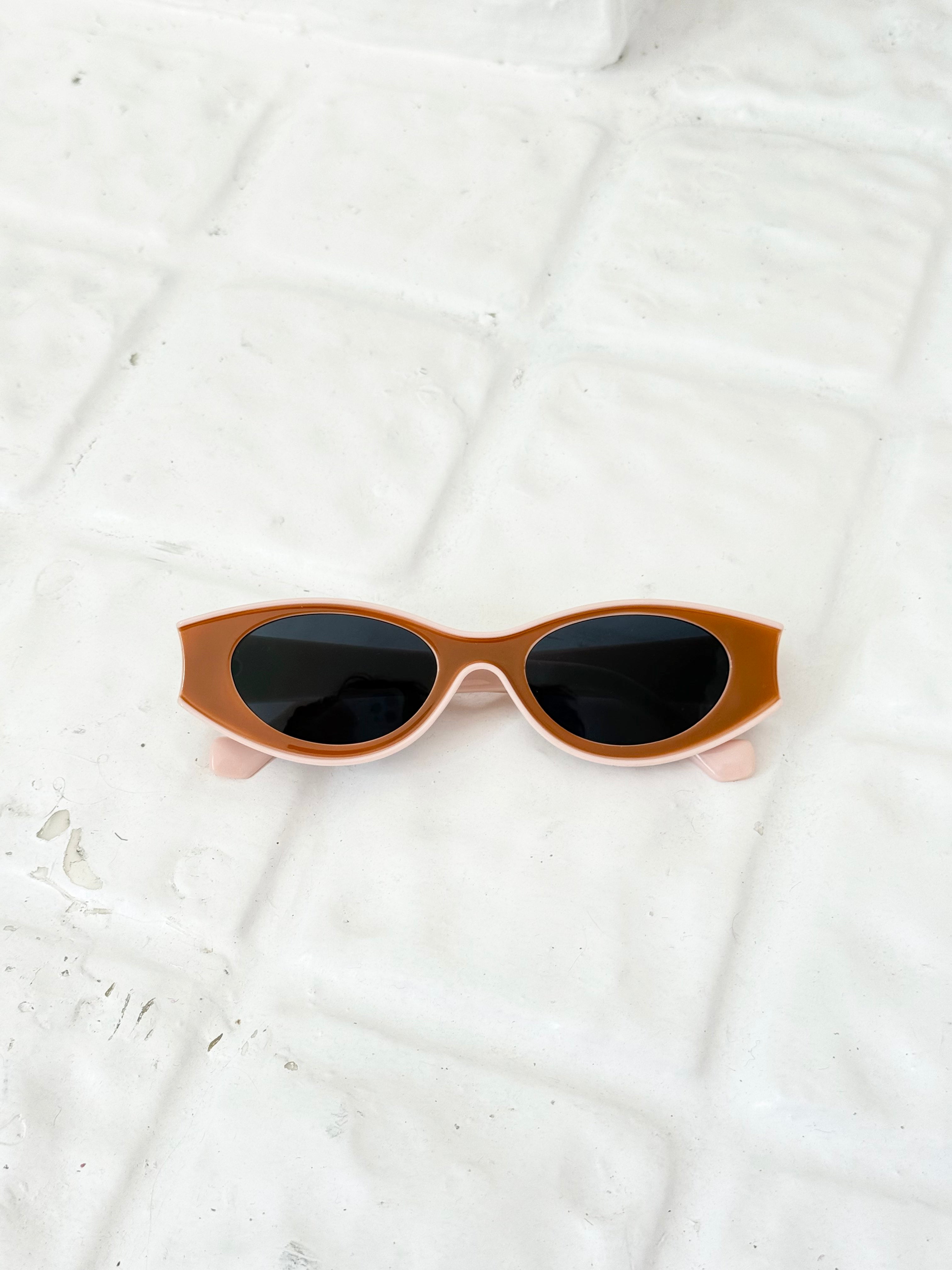 brown and pink oval slim sunglasses