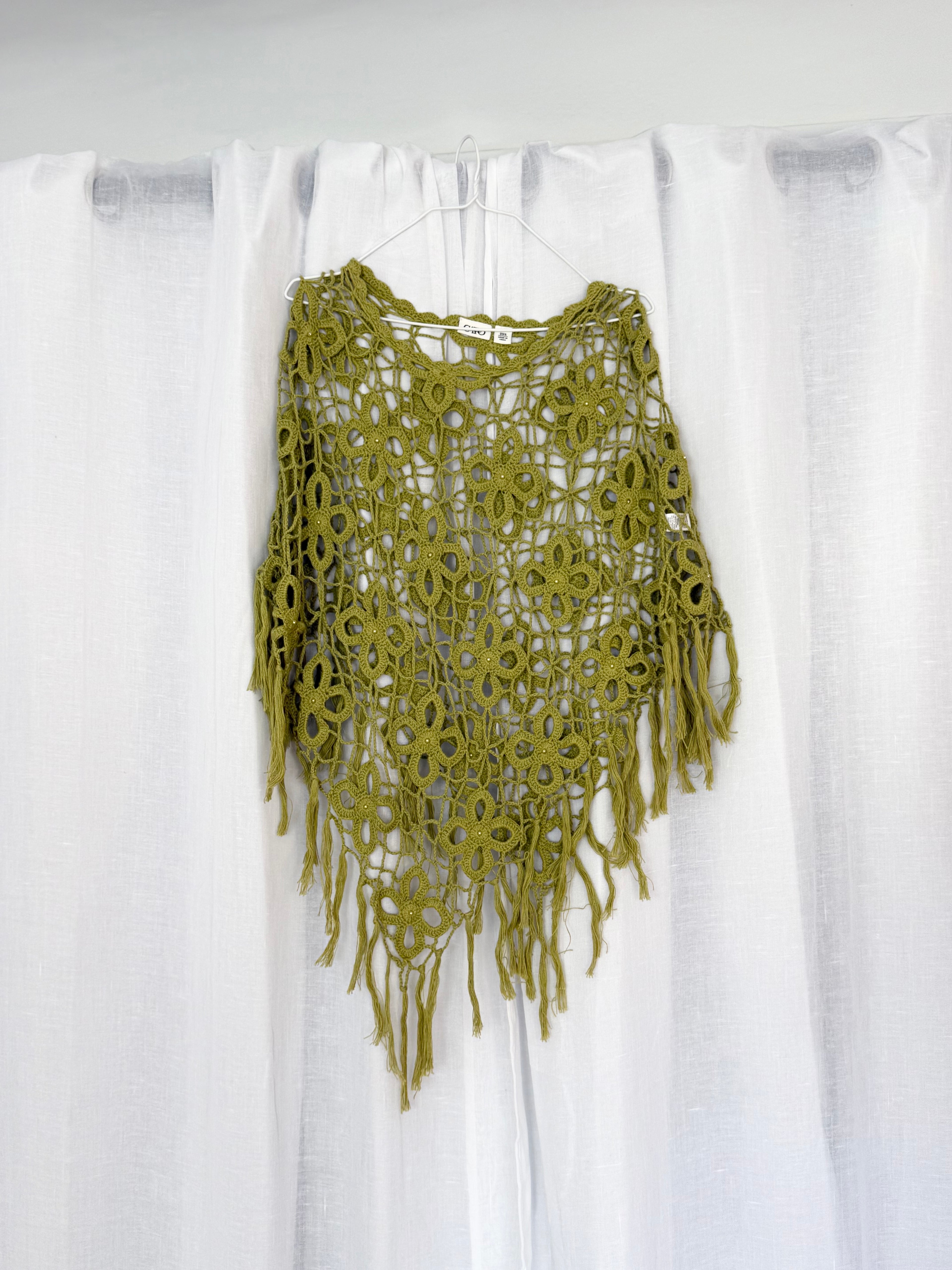 green crochet flower poncho