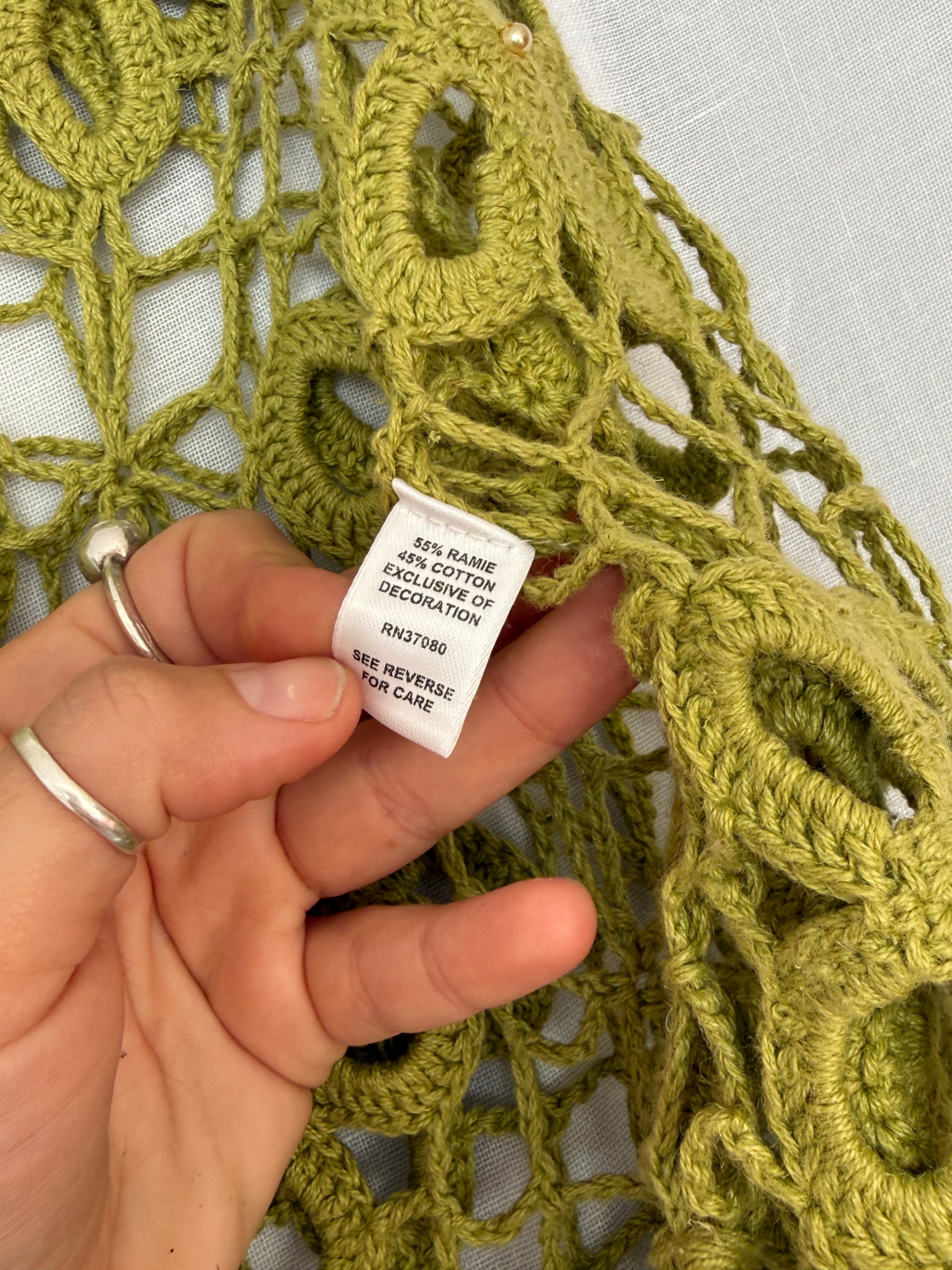 green crochet flower poncho