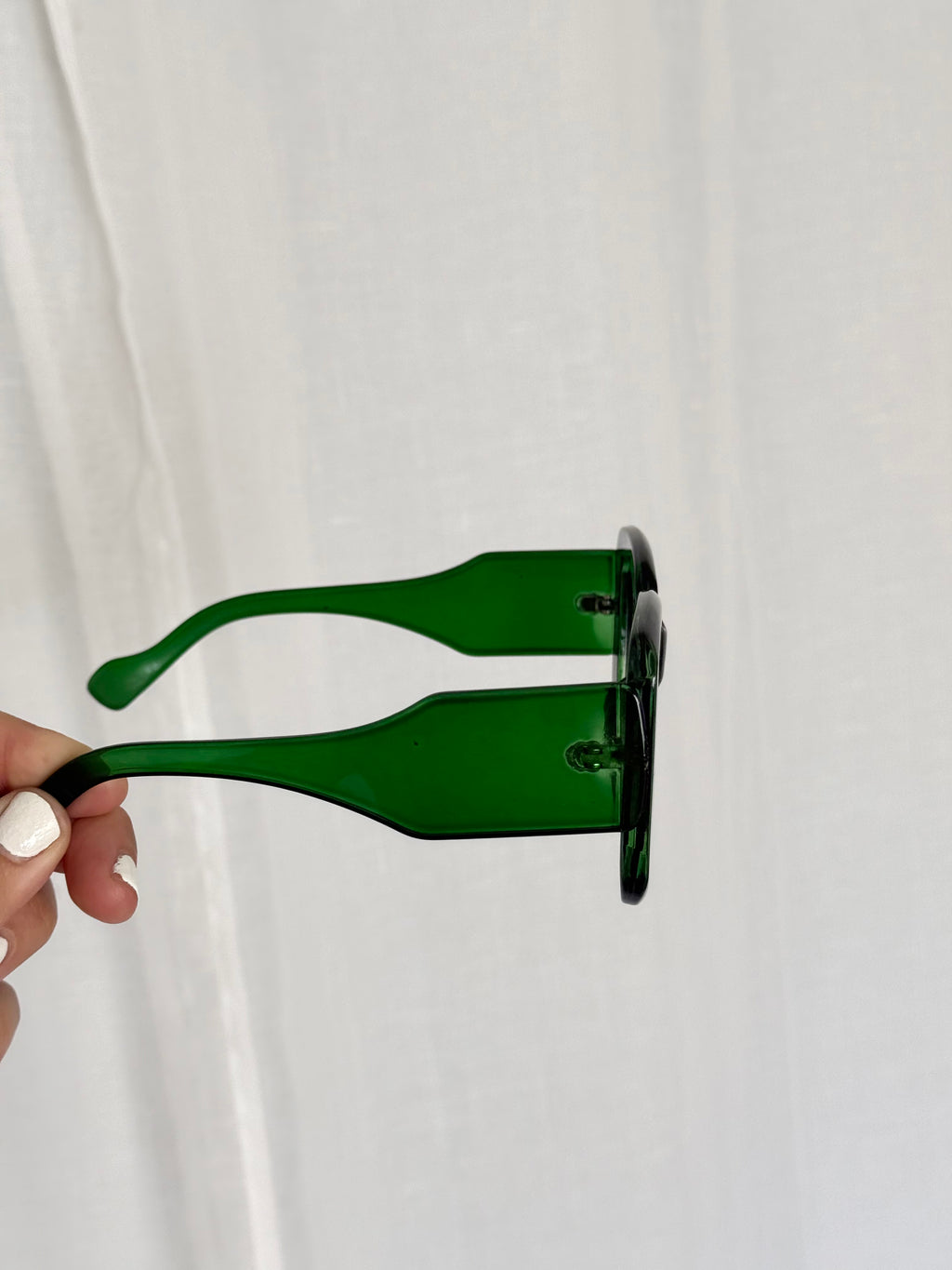 oversized green 70s inspired sunglasses